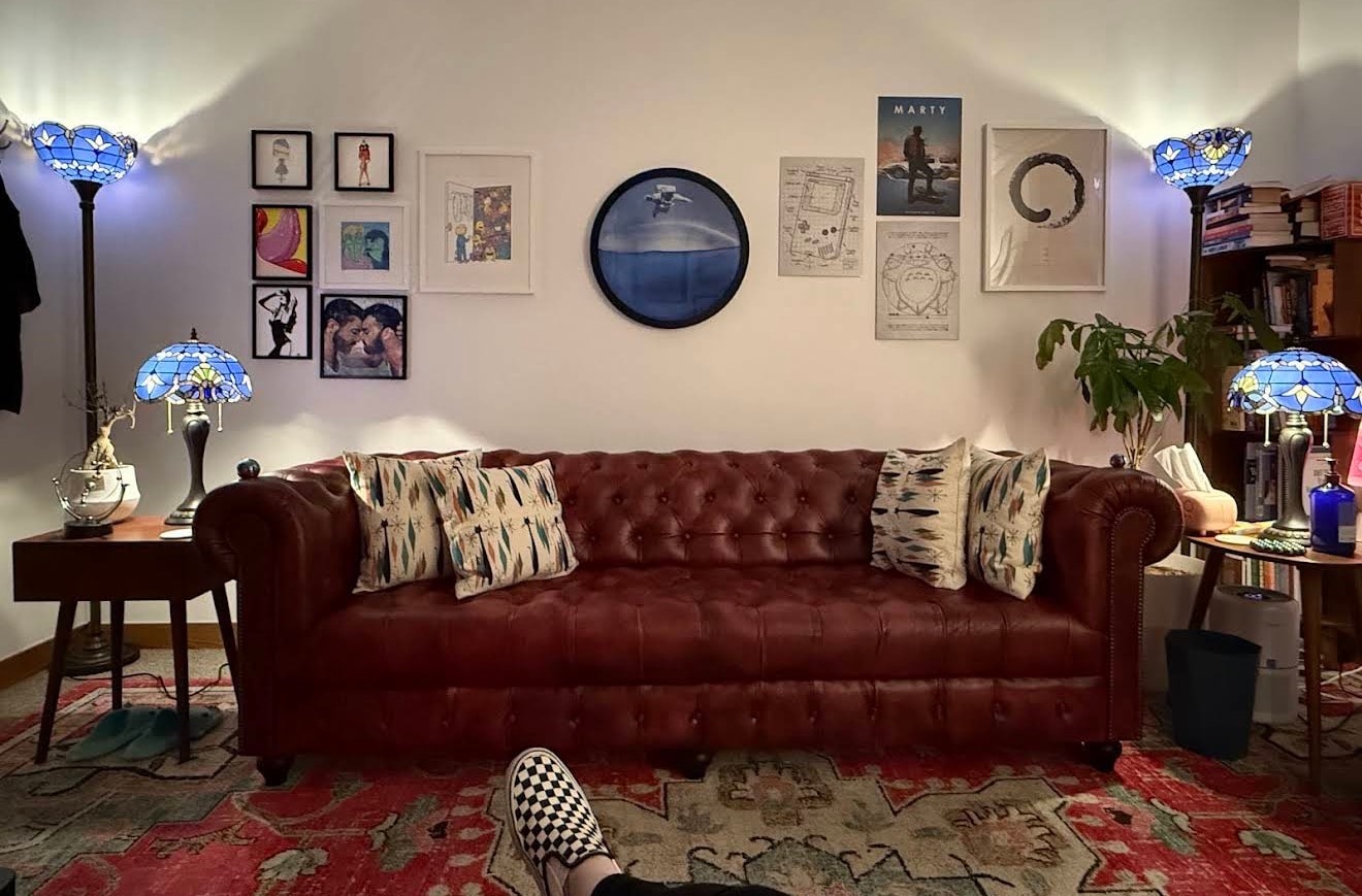 Love Psychotherapy office — burgundy Chesterfield chair and gallery wall